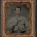 [Unidentified soldier in Confederate uniform with gun] (LOC)