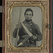 [Unidentified soldier in Confederate uniform with musket, D guard Bowie knife, and knife sheath labeled Philadelphia Avengers, N.Y.] (LOC)