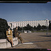 A soldier and a woman in a park, with the Old [Russell] Senate Office Building behind them, Washington, D.C. (LOC)