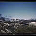 Santa Fe R.R. trains going through Cajon Pass in the San Bernardino Mountains, Cajon, Calif. On the right, streamliner "Chief" going west; in the background, on the left, a freight train with a helper engine, going east. Santa Fe trip (LOC)