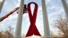 AIDS Ribbon Is Hung From The White House