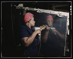 Operating a hand drill at Vultee-Nashville, woman is working on a "Vengeance" dive bomber, Tennessee (LOC)