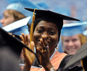 A graduate student applauds at December 2011 Commencent ceremony.