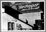 Negro man entering movie theater by 'Colored' entrance.