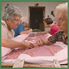 Image of women at their weekly quilting bee