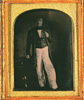 John Ross, full length portrait, facing front standing next to a small table. Daguerreotype, ca. 1850