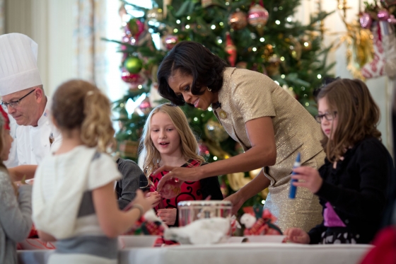 First Lady Michelle Obama participates in a craft project during the holiday press preview, Nov. 28, 2012