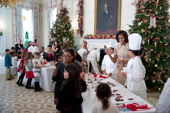 First Lady Michelle Obama Makes a honey tea stirrer during the holiday press preview, Nov. 28, 2012.