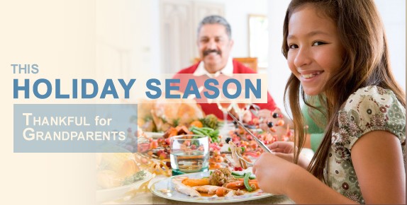 Girl eating at dinner table with grandfather