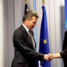 Photo: U.S. Secretary of State Hillary Rodham Clinton shakes hands with EU Energy Commissioner Günther Oettinger after the U.S.-EU Energy Council meeting in Brussels, Belgium, December 5, 2012. [State Department photo/ Public Domain]