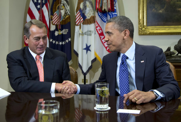 President Obama shakes hands with House Speaker John A. Boehner (R-Ohio) in the Roosevelt Room of the White House during a meeting to discuss the fiscal cliff.