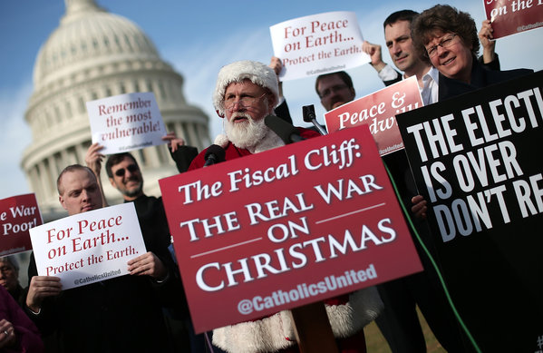 An unidentified man dressed as Santa Claus speaks outside the Capitol calling for Republicans to help resolve the fiscal cliff crisis.