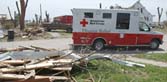 Red Cross emergency response vehicle at tornado disaster area