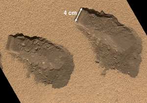 NASA's Mars Curiosity rover has conducted its first analysis of Martian soil samples using multiple instruments.
<br><br>
This is a view of the third (left) and fourth (right) trenches made by the 1.6-inch-wide (4-centimeter-wide) scoop on NASA’s Mars rover Curiosity in October 2012.<br>
<i>Credit: NASA/JPL-Caltech/MSSS</i>