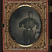 [Zouave portrait from: Two portraits of an unidentified soldier in Union uniform and Zouave uniform with bayonet and sheath, bowie knife, and Smith and Wesson revolver] (LOC)