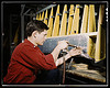 Riveter at work at the Douglas Aircraft Corporation plant in Long Beach, Calif. (LOC) by The Library of Congress