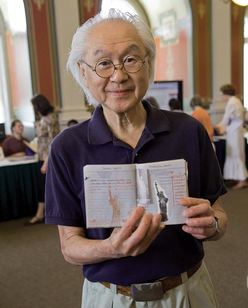 A man holding a book.