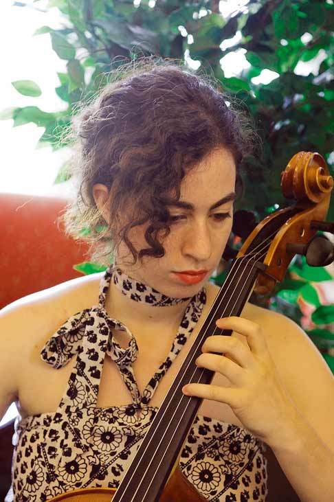 A woman playing the cello.