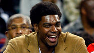 Knee injury keeping 76ers' Andrew Bynum off the court