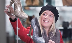 Sales record: A shopper looking at glittery shoes at John Lewis