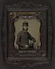 [Unidentified soldier in Union frock coat and forage cap holding book] (LOC) by The Library of Congress