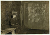 Vance, a Trapper Boy, 15 years old. Has trapped for several years in a West Va. Coal mine. $.75 a day for 10 hours work. All he does is to open and shut this door: most of the time he sits here idle, waiting for the cars to come ... (LOC) by The Library of Congress