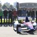 IndyCar drivers, from left, Ryan Hunter-Reay, Ed Carpenter, Sebastien Bourdais, Ryan Briscoe, Marco Andretti, Will Power, JR Hildebrand, Katherine Legge, Oriol Servia and Tony Kanaan stand behind an IndyCar during a news conference on Belle Isle in Detroit, Tuesday, Oct. 9, 2012, to promote the Detroit Grand Prix. The drivers toured the repaved track that fell apart last year when open-wheel racing made its return to the Motor City. (AP Photo/Carlos Osorio)