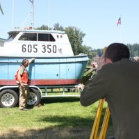 Photo: 2012 SKT Intern Brian Nice surveying the ALKI II with a Total Station to record the hull measurements.