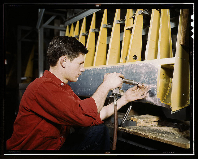 Riveter at work at the Douglas Aircraft Corporation plant in Long Beach, Calif. (LOC)