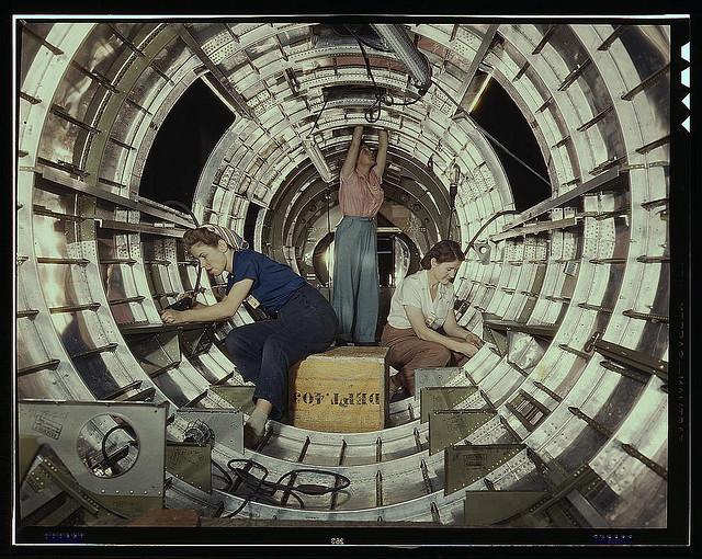 Women workers install fixtures and assemblies to a tail fuselage section of a B-17 bomber at the Douglas Aircraft Company plant, Long Beach, Calif. Better known as the "Flying Fortress," the B-17F is a later model of the B-17, which distinguished itself i