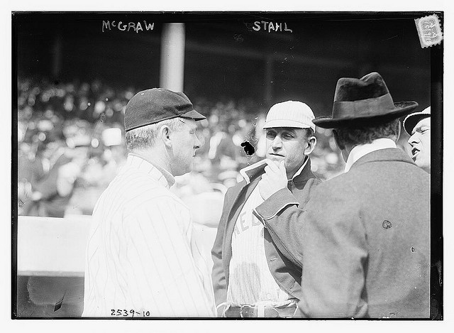 [John McGraw (New York NL) at left, speaking to Jake Stahl (Boston AL) prior to a game of the 1912 World Series at the Polo Grounds, NY, October 1912 (baseball)] (LOC)