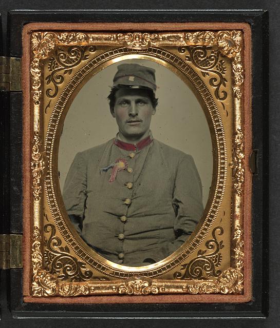 [Unidentified soldier in Confederate artillery jacket with secession badge and artillery forage hat]