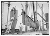 Putting 46 ton girder in place - Cons. Gas Co's Bldg. (LOC) by The Library of Congress