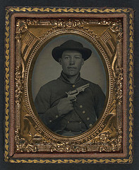 [Unidentified soldier in Union uniform with slouch hat holding revolver to chest] (LOC)