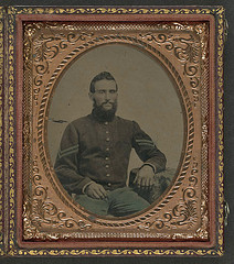 [Unidentified soldier in Union infantry corporal's uniform sitting with arm resting on table] (LOC)