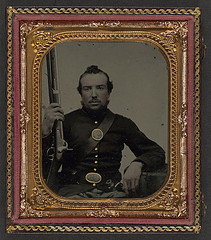 [Unidentified soldier in Union uniform with eagle breast plate holding a musket and bayonet in scabbard] (LOC)