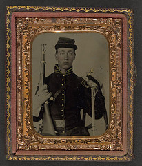[Unidentified soldier in Union cavalry uniform with percussion cap pistol carbine, attached stock, and cavalry saber] (LOC)