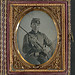 [Unidentified soldier in Confederate uniform with conversion musket and small Bowie knife] (LOC)