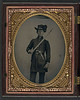 [Unidentified young soldier in Confederate uniform and Hardee hat with holstered revolver and artillery saber] (LOC) by The Library of Congress