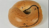 A guide to making a Mobius bagel. Cut along the black line.