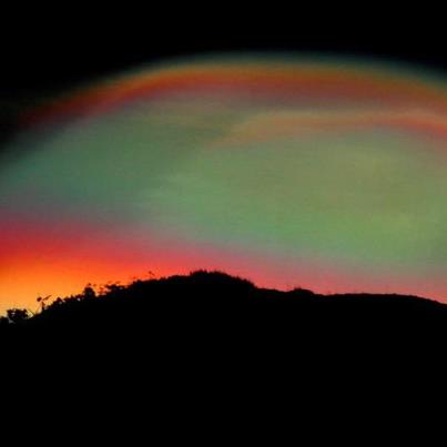 Photo: Shepherd's delight: Rainbow coloured 'mother-of-pearl' clouds shimmering in the night sky - http://bit.ly/ZEhGT7