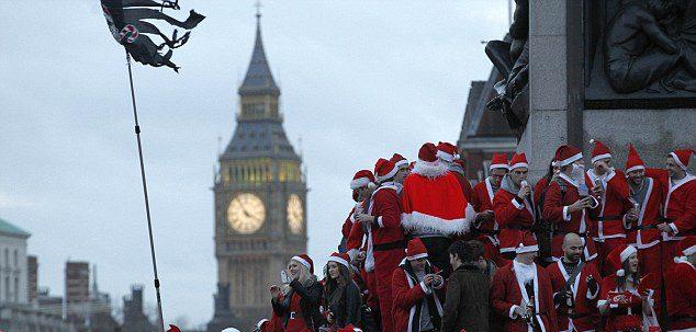 Photo: Santa Claus is coming to town: Thousands of Father Christmases gather in Trafalgar Square for flash mob  -http://bit.ly/Y7Xqc0