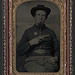 [Unidentified soldier in Union shell jacket with 7th Corps Dept. of Arkansas insignia and 1851 rectangular eagle belt plate holding volcanic pistol to his chest] (LOC)