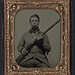 [Unidentified soldier in Confederate uniform with musket] (LOC)