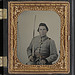 [Unidentified soldier in Confederate lieutenant uniform and CS belt buckle with cavalry sword] (LOC)