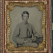 [Unidentified soldier in Confederate private's uniform with cased photograph] (LOC)