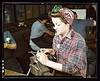 One of the girls of Vilter [Manufacturing] Co. filing small gun parts, Milwaukee, Wisc. One brother in Coast Guard, one going to Army. (LOC) by The Library of Congress