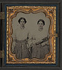 [Sisters Lucretia Electa and Louisa Ellen Crossett in identical skirts, blouses, and jewelry with weaving shuttles] (LOC) by The Library of Congress