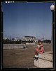 Little girl in a park with Union Station in the background, Washington, D.C. (LOC) by The Library of Congress