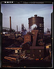 Hanna furnaces of the Great Lakes Steel Corporation, Detroit, Mich. General view showing tank which stores gas from the coke oven. Square building and extension in middle ground is where coal is fed to a feeder belt and then transferred to a storage place by The Library of Congress